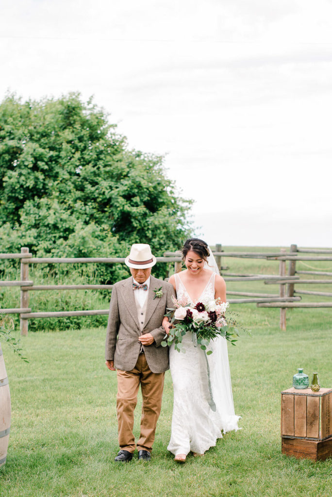 Burgundy flower bouquet with soft accents at this farm wedding located in Alberta Canada. https://www.thegathered.ca