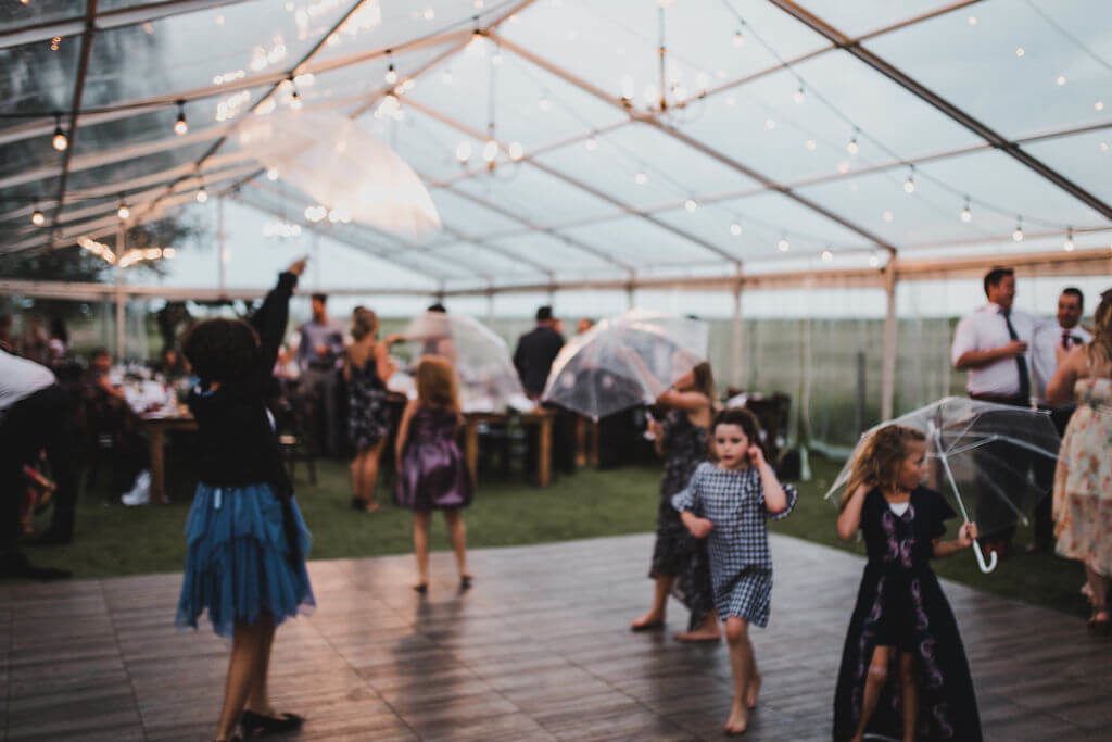 tent wedding dance with clear umbrellas https://www.thegathered.ca