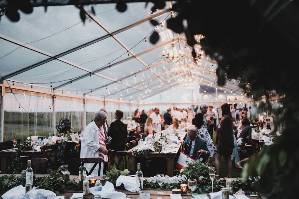 tent wedding reception with warm glowing lights. https://www.thegathered.ca