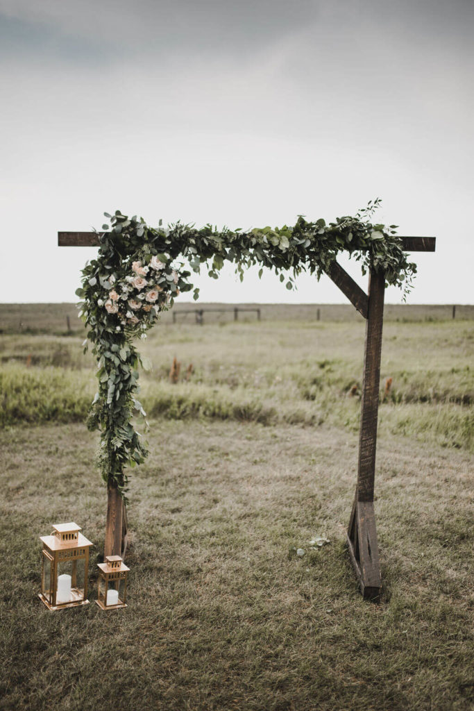 wedding flower arch with greenery https://www.thegathered.ca