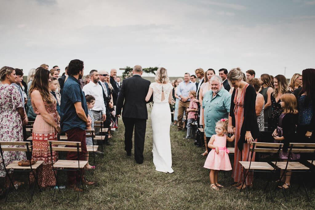 outdoor wedding ceremony in a field https://www.thegathered.ca