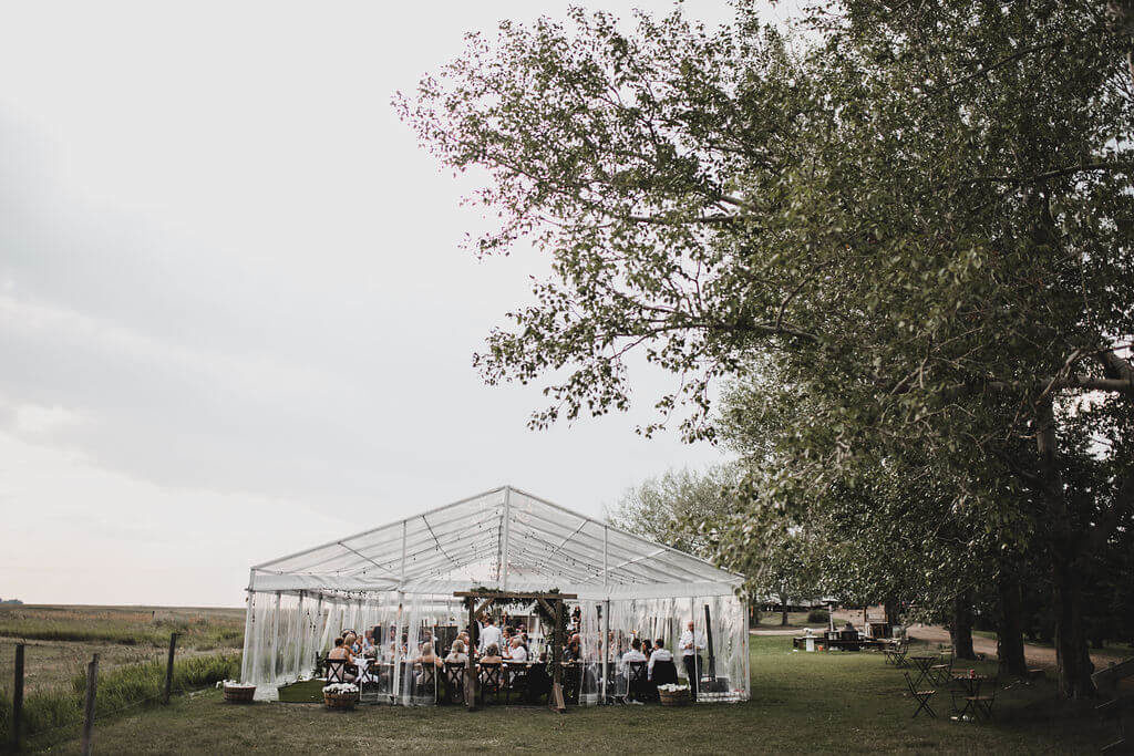 Clear tented outdoor farm wedding https://www.thegathered.ca