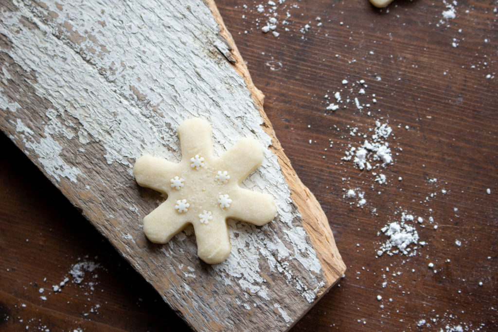 the best shortbread cookies, star shaped cookie with white sprinkles 