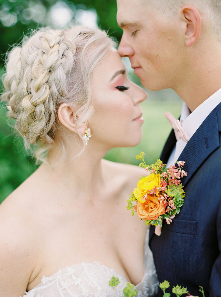 braided bridal hair keeps the hair in place on the wedding day in spring or summer weather