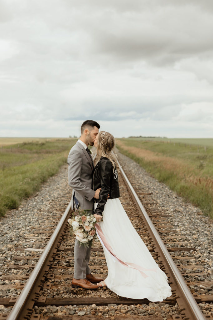 railroad wedding couple in a prairie setting