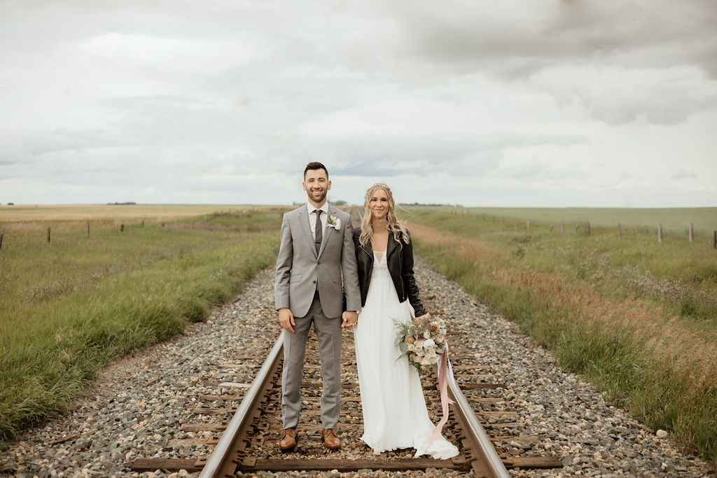 railroad wedding couple in a prairie setting