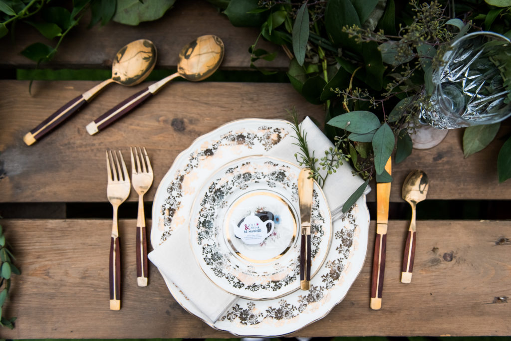 antique china with gold and wood flatware - the perfect setting for an outdoor wedding