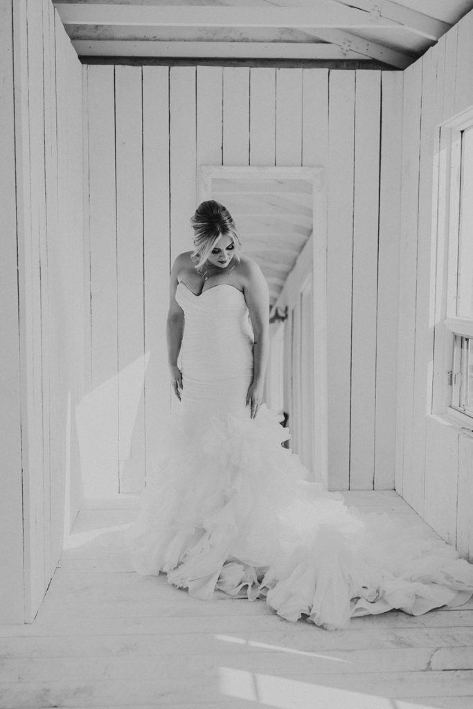 black and white image of the bride in her mermaid style wedding dress