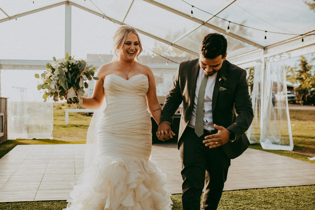 couple makes their way into their reception space for their grand entrance