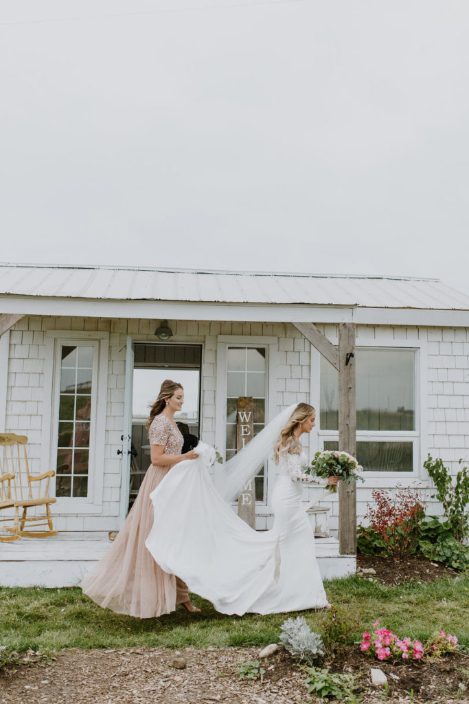 White Bridal Cottage with a brides lacy dress and long white veil - The Gathered in Calgary, Alberta