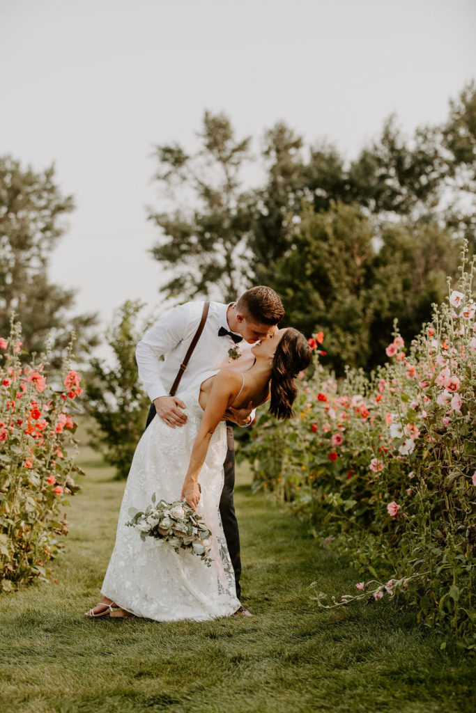 Brett and Haley - Pink Hollyhocks and A Warm Summer Breeze, in Alberta, Canada. The Gathered