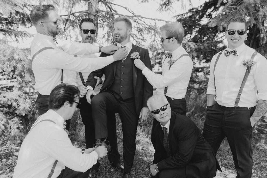 A black and white photo of a group of groomsmen.