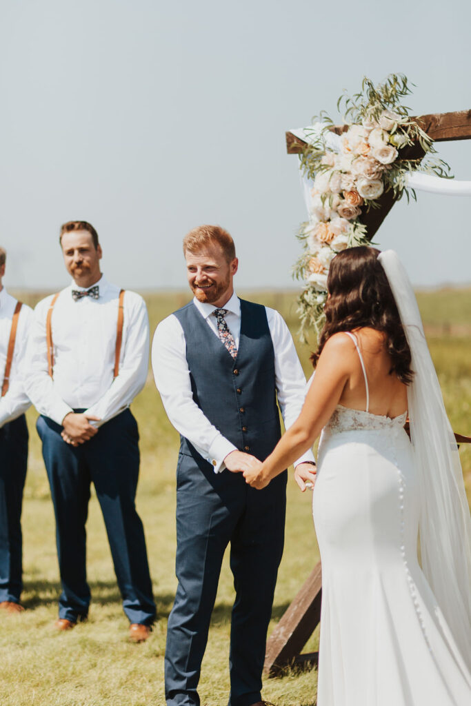 A wedding ceremony with bridesmaids and groomsmen.