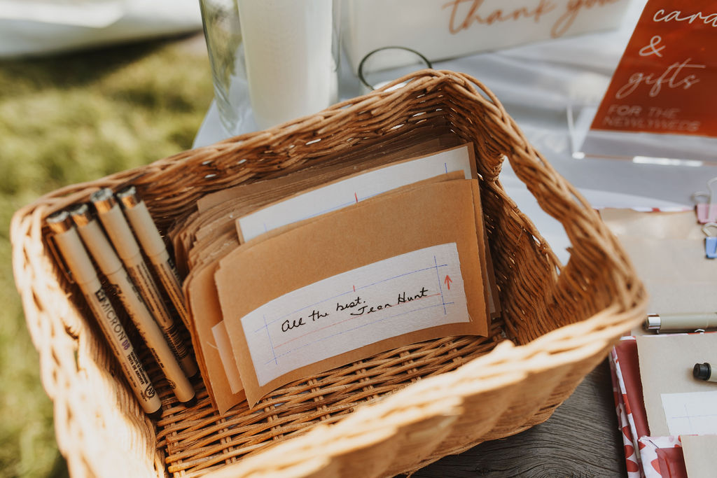 A wicker basket with thank you cards on it.
