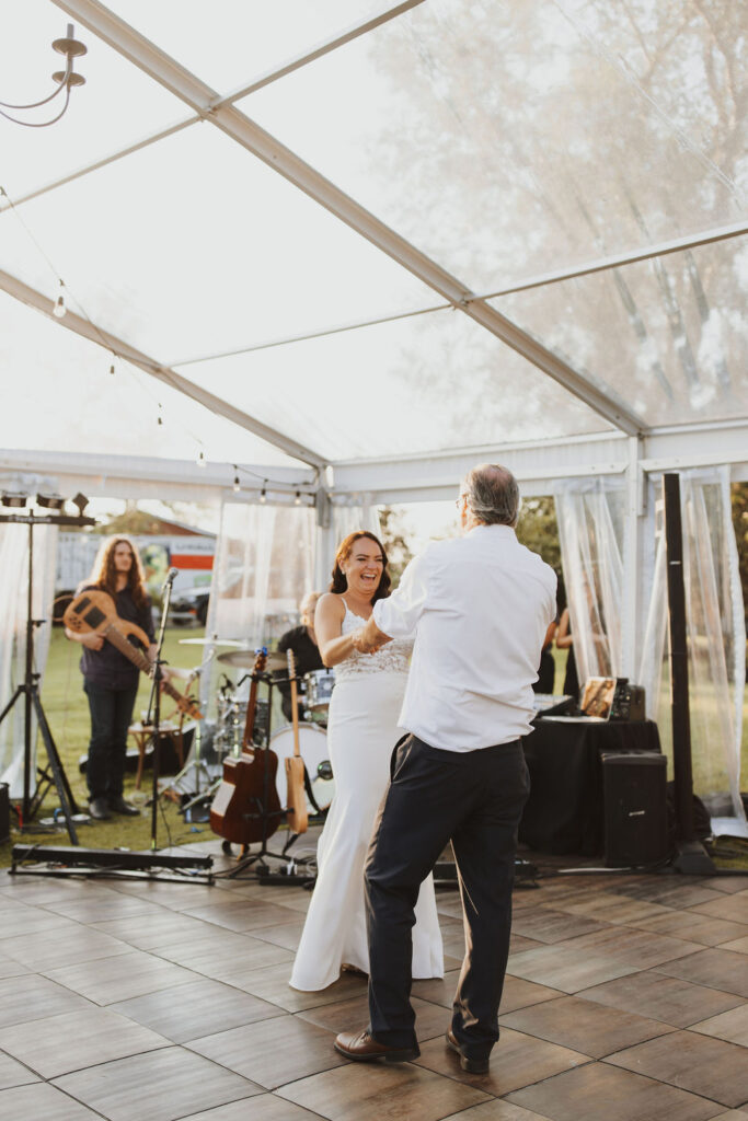A bride and groom dancing in a tent. Enchanting Outdoor Dinner Party