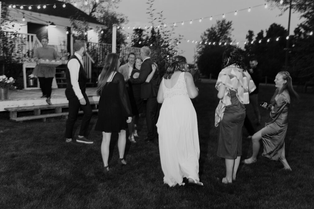 A black and white photo of a group of people at a wedding.