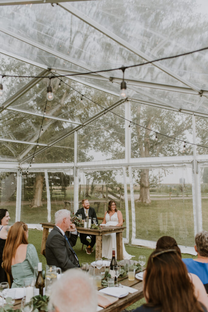 A wedding reception in a tent.