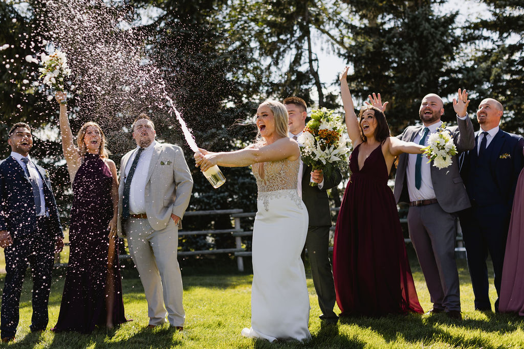 A group of people throwing confetti.