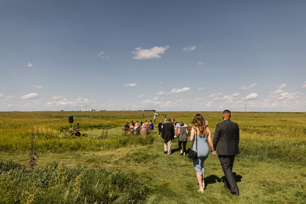 A group of people walking in a field.